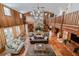 High-ceiling living room with a lofted area and stone fireplace at 18029 Lake Reflections Blvd, Lutz, FL 33558