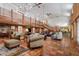 Spacious living room with high ceilings, a stone fireplace, and tiled floors at 18029 Lake Reflections Blvd, Lutz, FL 33558