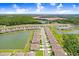 Community overview with lake and homes at 18058 Turning Leaf Cir, Land O Lakes, FL 34638