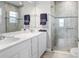 Modern bathroom with walk-in shower and double vanity at 18058 Turning Leaf Cir, Land O Lakes, FL 34638