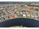 Community overview showing houses and a lake at 1809 Wolf Laurel Dr, Sun City Center, FL 33573