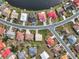 High-angle view of houses near a lake in a community at 1809 Wolf Laurel Dr, Sun City Center, FL 33573