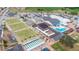 Aerial view of community showing recreational facilities and parking at 1809 Wolf Laurel Dr, Sun City Center, FL 33573