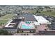 Aerial view of community center with pool, parking and recreational areas at 1809 Wolf Laurel Dr, Sun City Center, FL 33573