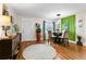 Bright dining area with a round rug and stylish decor at 1809 Wolf Laurel Dr, Sun City Center, FL 33573