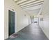 Condo hallway with light walls, a dark-green door, and a tiled floor at 18402 Bridle Club Dr # 18402, Tampa, FL 33647