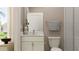 Small bathroom with white vanity, toilet, and shower at 18412 Serene Lake Loop, Lutz, FL 33548