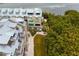 Aerial view of townhouses near the water with metal roofs and balconies at 19915 Gulf Blvd # 303, Indian Shores, FL 33785