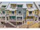 Aerial view of townhouses with multiple levels, balconies, and staircases at 19915 Gulf Blvd # 303, Indian Shores, FL 33785