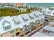 Aerial view of townhouses near the beach with metal roofs and balconies at 19915 Gulf Blvd # 303, Indian Shores, FL 33785