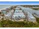 Aerial view of waterfront community with boat slips and beach access at 19915 Gulf Blvd # 303, Indian Shores, FL 33785