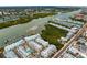 Aerial view of a waterfront community with lush landscaping and boat docks at 19915 Gulf Blvd # 303, Indian Shores, FL 33785