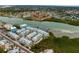 Aerial view of waterfront homes and community with boat docks at 19915 Gulf Blvd # 303, Indian Shores, FL 33785