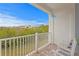 Private balcony with white railing and outdoor seating at 19915 Gulf Blvd # 303, Indian Shores, FL 33785