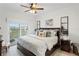 Spacious bedroom with a king-size bed and private balcony access at 19915 Gulf Blvd # 303, Indian Shores, FL 33785