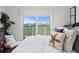 Bright bedroom with sliding glass doors leading to a balcony at 19915 Gulf Blvd # 303, Indian Shores, FL 33785