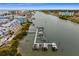 Aerial view of a community boat dock with multiple boat slips at 19915 Gulf Blvd # 303, Indian Shores, FL 33785