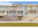 Three-story townhouses with private balconies and attached garages at 19915 Gulf Blvd # 303, Indian Shores, FL 33785