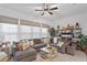 Cozy living room with L-shaped sectional sofa and built-in shelving at 19915 Gulf Blvd # 303, Indian Shores, FL 33785