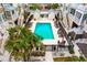 Community pool area with lounge chairs and surrounding buildings at 19915 Gulf Blvd # 303, Indian Shores, FL 33785