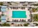 Overhead view of community pool, with surrounding lounge chairs at 19915 Gulf Blvd # 303, Indian Shores, FL 33785