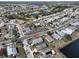 Aerial view of single-Gathering home in a residential community with golf course and lake nearby at 243 Linger Ln, Sun City Center, FL 33573