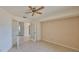 Bright bedroom with tile floors and ceiling fan at 243 Linger Ln, Sun City Center, FL 33573