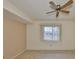 Simple bedroom with tiled floors and window with blinds at 243 Linger Ln, Sun City Center, FL 33573