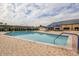 Resort-style pool with patio and seating at 243 Linger Ln, Sun City Center, FL 33573