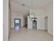 Bright dining room with tile floors and view of kitchen at 243 Linger Ln, Sun City Center, FL 33573