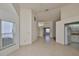 Bright dining room with tile floors and views to kitchen at 243 Linger Ln, Sun City Center, FL 33573