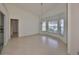 Spacious dining area with large windows and tile flooring at 243 Linger Ln, Sun City Center, FL 33573