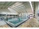 Indoor heated pool with accessibility ramp at 243 Linger Ln, Sun City Center, FL 33573