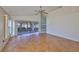 Spacious living room with herringbone floors and sliding doors leading to a patio at 243 Linger Ln, Sun City Center, FL 33573