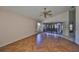 Living room with herringbone tile floors and view to Florida Room at 243 Linger Ln, Sun City Center, FL 33573