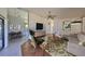 Mid-century modern living room featuring a neutral color palette and stylish furniture at 243 Linger Ln, Sun City Center, FL 33573