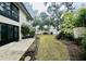 Private backyard with grass and landscaping at 2750 E Bay Dr # 1E, Largo, FL 33771