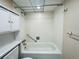 Bathroom with shower/tub combo and white tiled walls at 2750 E Bay Dr # 1E, Largo, FL 33771