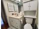 Bathroom featuring vanity, toilet, and medicine cabinet at 2750 E Bay Dr # 1E, Largo, FL 33771