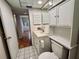 Neat bathroom with toilet, vanity, and access to bedroom at 2750 E Bay Dr # 1E, Largo, FL 33771