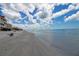 Stunning beach view with white sand and clear water at 2750 E Bay Dr # 1E, Largo, FL 33771