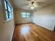 Bright bedroom with wood floors and ceiling fan at 2750 E Bay Dr # 1E, Largo, FL 33771