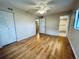 Laminate wood floor bedroom with door to bathroom at 2750 E Bay Dr # 1E, Largo, FL 33771