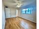 Bedroom with laminate flooring, ceiling fan, and ample closet space at 2750 E Bay Dr # 1E, Largo, FL 33771