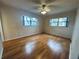 Bright bedroom with wood floors and ceiling fan at 2750 E Bay Dr # 1E, Largo, FL 33771