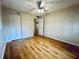 Bedroom with wood floors and ceiling fan at 2750 E Bay Dr # 1E, Largo, FL 33771