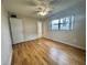 Bright bedroom with laminate wood floors and ceiling fan at 2750 E Bay Dr # 1E, Largo, FL 33771