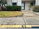 Building entrance with walkway and landscaping at 2750 E Bay Dr # 1E, Largo, FL 33771