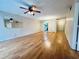 Bright living room with laminate floors and ceiling fan at 2750 E Bay Dr # 1E, Largo, FL 33771