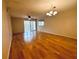 Spacious living room with laminate wood floors and access to a lanai at 2750 E Bay Dr # 1E, Largo, FL 33771